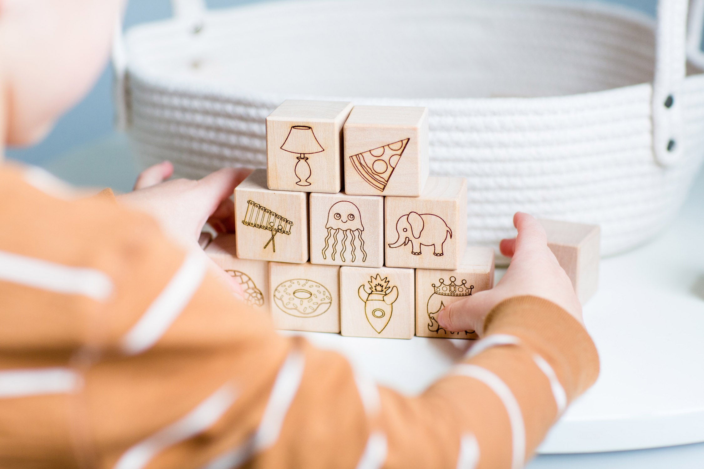 Child stacking wooden abc blocks