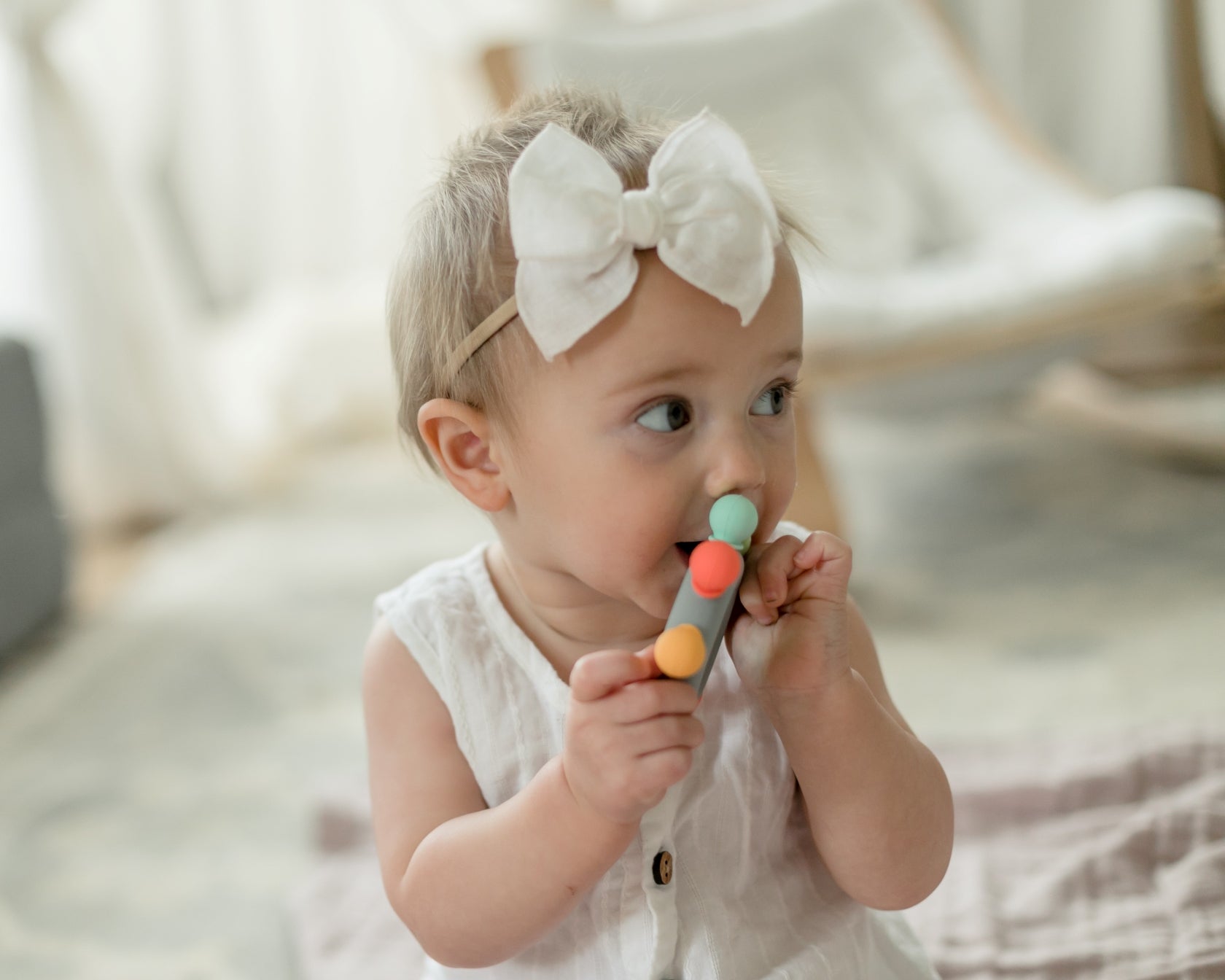 Captains Teether - Bannor-toys - baby girl chewing on teether