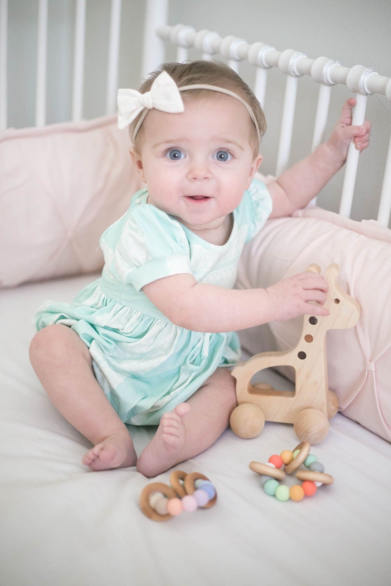 Girl playing with Giraffe Push Toy - Bannor-toys